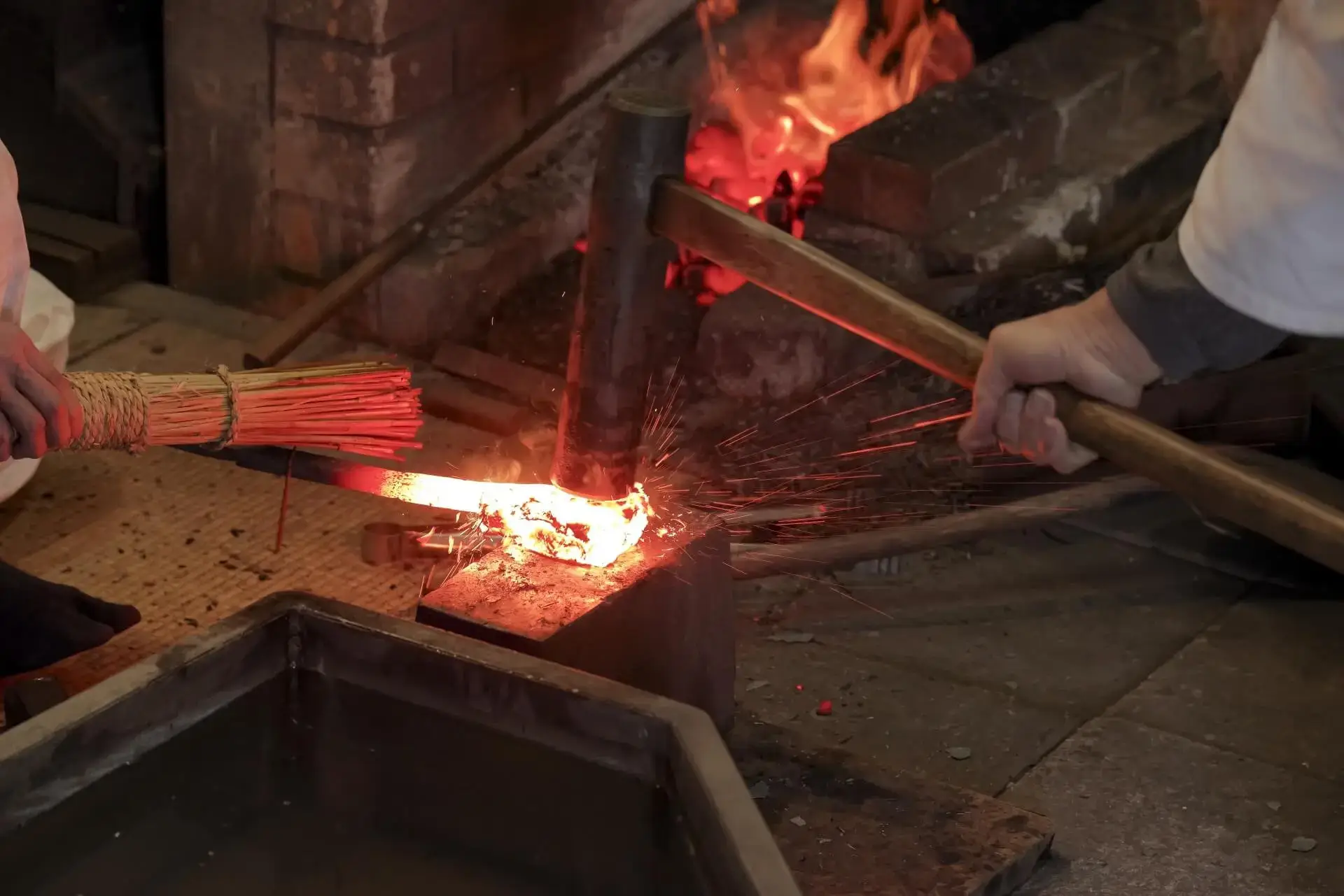 Traditional Japanese knife workshop in Sakai, tools and blades on a wooden bench