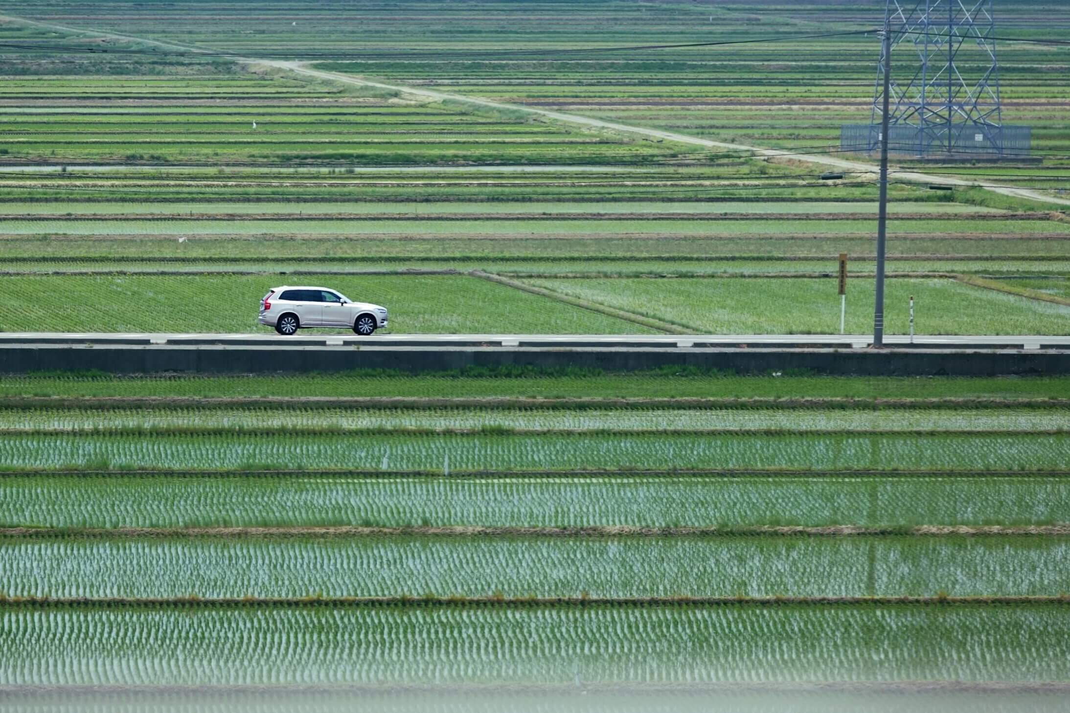 Why Rural Japan Needs You to Visit Differently rice paddy and a white car on road