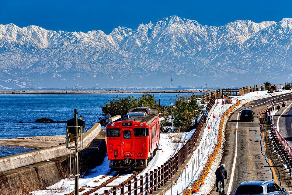 Amaharashi coast Himi line train Tateyama mountain range Toyama