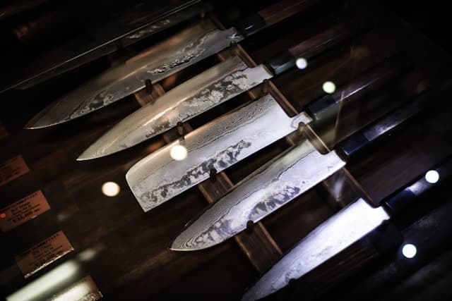 Close-up of Japanese knife blade showing Damascus steel pattern and fine edge