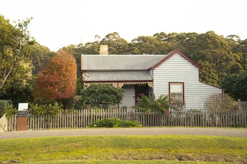 Valued at Zero: Why Japan's Old Houses Lose Their Worth, and Why Some Are Reclaiming It Sunlit street in Australian suburb with restored heritage cottage