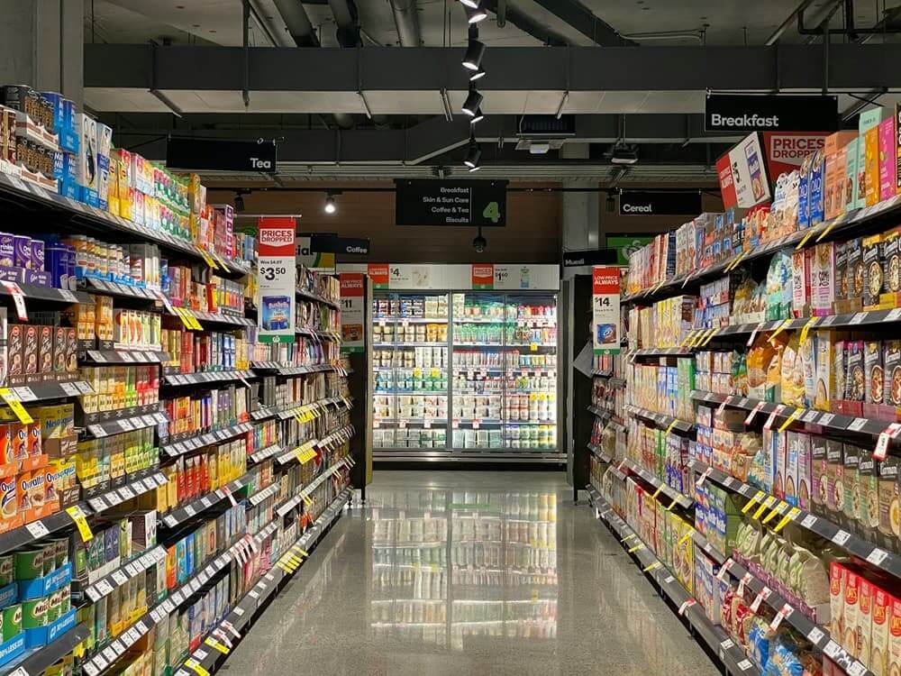 How to Cook Perfect Japanese Rice Abroad (Without an Expensive Rice Cooker) Grocery store aisle with stocked shelves in an Australian supermarket
