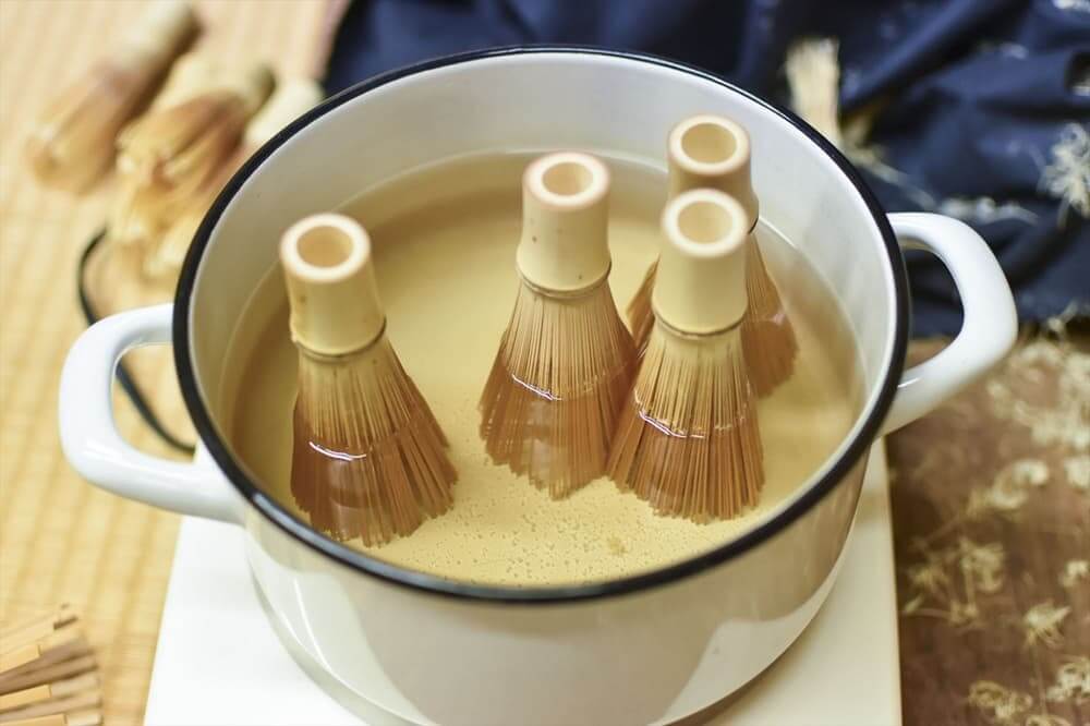 How to Choose an Authentic Japanese Chasen (And Why They're So Hard to Find) Bamboo strands being softened in hot water before shaping