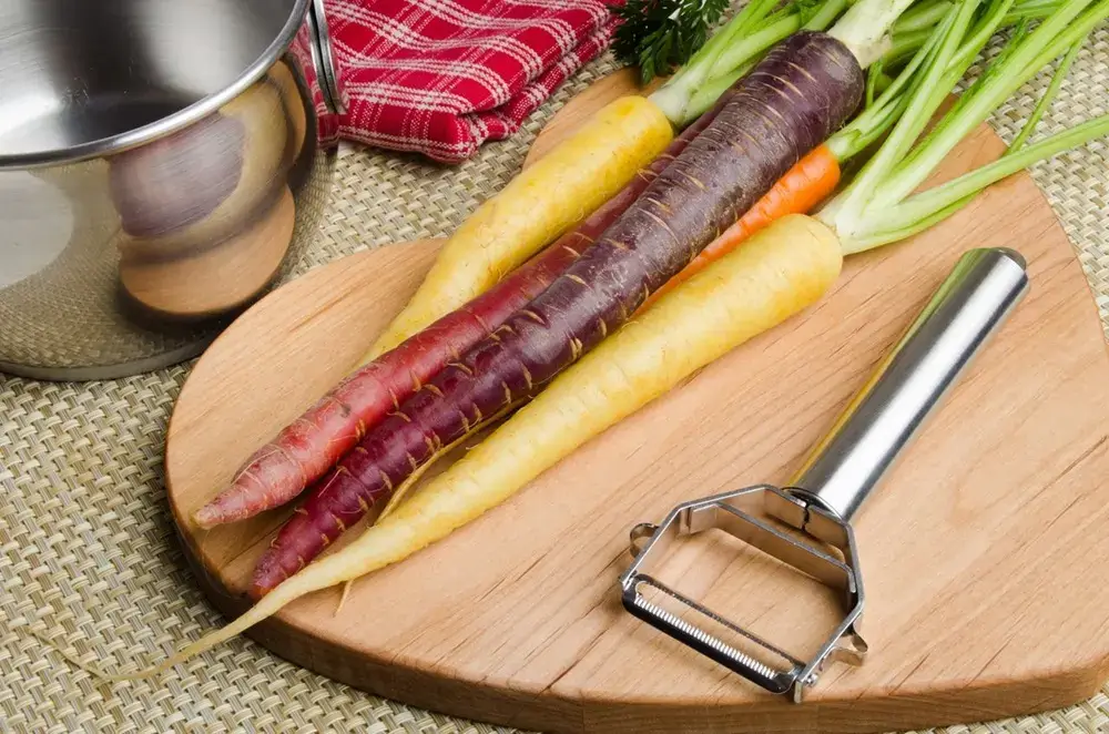 Everyday Thoughtfulness: The Quiet Thinking Behind Japanese Household Products Vegetable peeler and carrots on a wooden cutting board