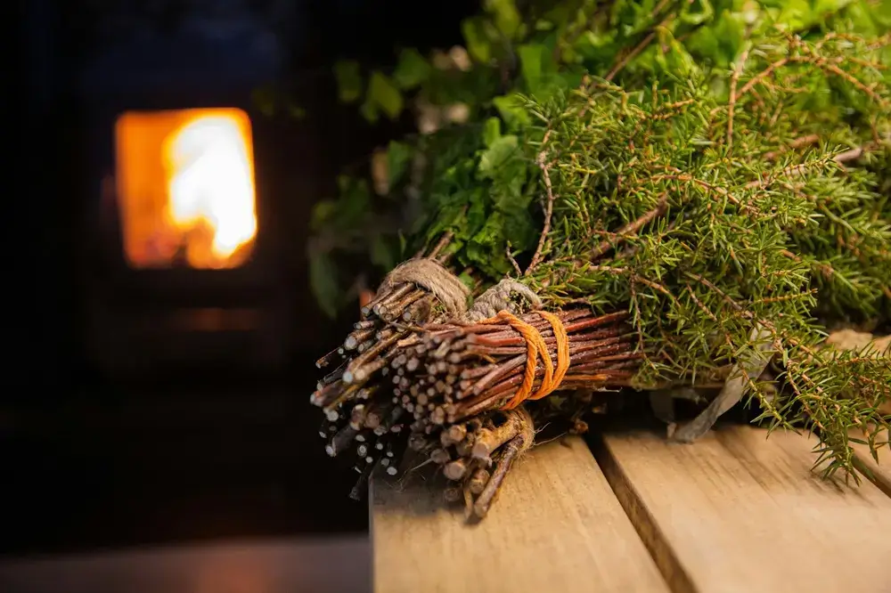 Why Torture Yourself? Why Japan’s Businesspeople Became Obsessed With Sauna Two juniper whisks resting on a wood-burning sauna bench
