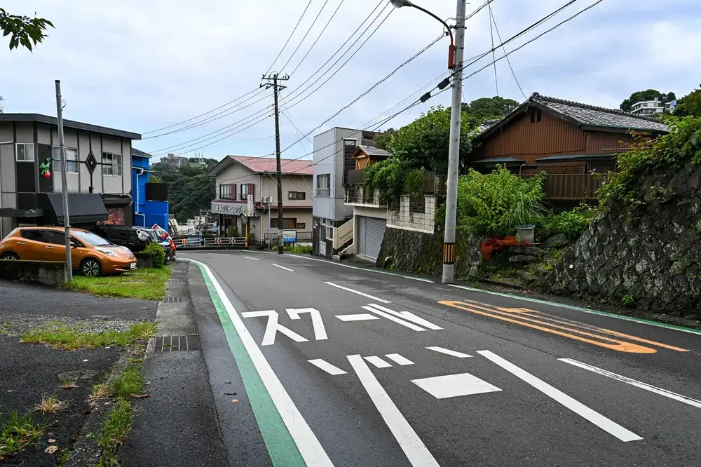 Why Japanese Children Walk to School Alone Green Belt marking along a Japanese school zone road