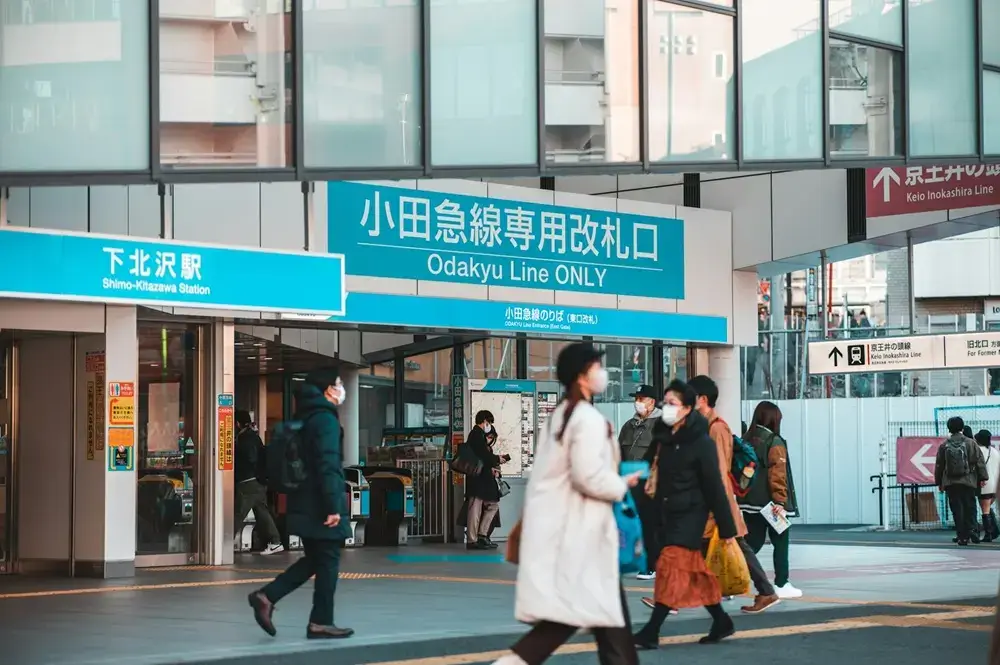 Why Japanese Children Walk to School Alone People walking across a crossing toward a Japanese train station