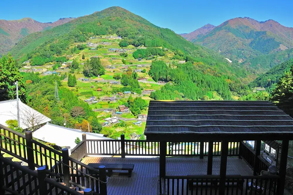 Ochiai Village houses spread across a steep green mountainside in Iya, Tokushima
